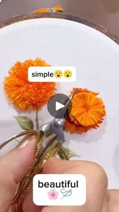 someone is cutting flowers with scissors on a white plate that says simple, beautiful and smile