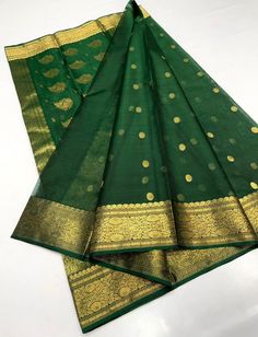 1.this is beautiful pure karan handwoven chanderi silk sari with with running blouse piece 2.this sari is 5.5 mt length  3.this is a very elegant looking sari for all occasions like weddings and other formal events  4.fall n pico is complimentary  5.blouse can be made as per the requirements of the clients with proper measurements.stiching charges will be extra  6.plz check the availability of the sari before placing the order Elegant Green Cotton Silk Lehenga, Designer Cotton Silk Lehenga With Pallu, Festive Designer Wear Tilla Dupatta, Traditional Cotton Silk Lehenga For Festive Occasions, Cotton Silk Lehenga For Festivals, Cotton Silk Lehenga With Dupatta For Festivals, Festive Green Traditional Wear With Tilla, Traditional Cotton Silk Choli With Pallu, Designer Chanderi Dupatta With Tilla