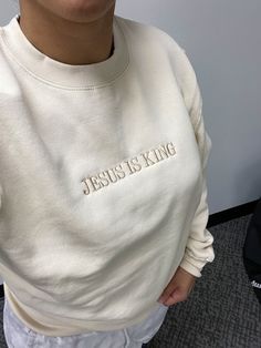 God is Good & Jesus is King Crewneck sweatshirts! Super adorable Faith Based Crewnecks! Choose one or both! You can customize the sweatshirt color and thread colors!  **THIS LISTING IS FOR ONE SWEATSHIRT** Hoodies and Sweatshirts are MIDWEIGHT and are super soft on the inside! The God is Good sweatshirt pictured is ROSE with WHITE Thread The Jesus is King sweatshirt pictured is CREAM with KHAKI Thread These are embroidered on my commercial embroidery machine. I will use the best brand sweatshirt Cream Long Sleeve Sweatshirt With Letter Print, Cream Long Sleeve Letter Print Sweatshirt, Cream Crew Neck Sweatshirt With Letter Print, Cream Sweatshirt With Embroidered Logo Relaxed Fit, White Fleece Sweatshirt With Embroidered Text, Cream Sweatshirt With Embroidered Text For Fall, Oversized White Sweatshirt With Letter Embroidery, Cream Fleece Hoodie With Crew Neck, Cream Embroidered Crew Neck Sweatshirt