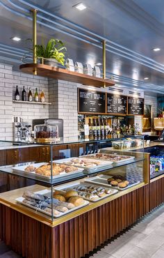 the inside of a bakery with lots of pastries