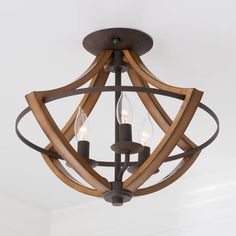 a wooden light fixture hanging from the ceiling