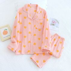 If you're looking for a stylish yet comfortable set of pajamas, then look no further than our Women's Cotton Crepe Long Sleeve 2 Piece Pajama Set. The set includes a top and bottom and is machine washable. Whether you're a man who needs a new set of pajamas, or a woman who wants to buy a gift for her man, this is the perfect set for you. This loungewear is all you need to help relax at home. They are soft and easy to touch which projects versatility and effortless grace in every step you take. M Long Sleeve Matching Set Sleepwear For Lounging, Long Sleeve Sleepwear Matching Set For Lounging, Orange Cotton Sleepwear For Loungewear, Orange Relaxed Fit Sleepwear, Orange Sleepwear For Spring Sleepover, Cotton Sleepwear Matching Set With Long Sleeves, Pink Relaxed Fit Long Sleeve Set, Orange Long Sleeve Sleepwear For Sleepover, Pink Long Sleeve Matching Set Sleepwear