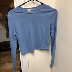 -New Without Tags.Never Worn No Flaws! -Size:Small (Has Stretch,Cotton) -Urban Outfitters -Slightly Cropped Blue T-shirt For Everyday Fall Wear, Blue Urban Outfitters T-shirt For Spring, Blue Cropped Cotton T-shirt, Blue Tops For Everyday Fall Wear, Light Wash Long Sleeve Casual Tops, Light Wash Long Sleeve Relaxed Fit Tops, Light Wash Long Sleeve Top With Relaxed Fit, Casual Light Wash Long Sleeve Tops, Casual Long Sleeve Light Wash Tops