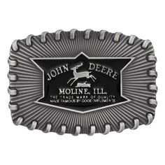 John Deere Stitched Buckle Antiqued silver finished squared oval Attitude buckle with whip stitched edging, radiating design and black John Deere logo. Standard 1.5 inch belt swivel. Dimensions: 3.72" X 2.6" Materials: Silver plate over a solid cast white metal alloy base. Paint. Montana Armor protective finish to prevent tarnish. Warranty: 1 year limited warranty on manufacturing defects when accompanied by a receipt. Vintage Black Adjustable Belt Buckles, Vintage Adjustable Black Belt Buckles, Adjustable Black Belt For Rodeo, Black Adjustable Belt For Rodeo, Classic Black Rectangular Belt Buckles, Classic Black Concho Belt Buckles, Western Black Belt Buckles With Silver Detail, Western Black Belt Buckles With Silver Buckle, Black Western Belt Buckles With Silver Buckle