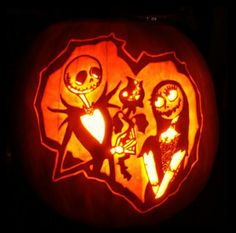 a pumpkin carved to look like the characters from the animated movie jack and sally with their cat