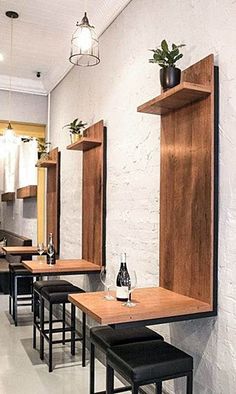 an empty restaurant with wooden tables and stools