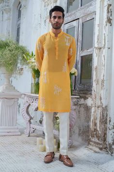 Yellow full sleeves kurta with royal peacock beaded embroidery. Paired with an ivory trouser. - Aza Fashions Yellow Bandhgala With Chikankari Embroidery, Yellow Long Sleeve Bandhgala With Chikankari Embroidery, Long Sleeve Cotton Silk Sherwani With Dabka Work, Long Sleeve Cotton Silk Sherwani With Intricate Embroidery, Navratri Bandhgala With Long Sleeves And Dabka Work, Yellow Unstitched Suit With Intricate Embroidery, Festive Cotton Silk Kurta With Naqshi, Long Sleeve Cotton Silk Kurta With Intricate Embroidery, Traditional Yellow Lawn Suit With Intricate Embroidery