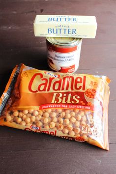 two bags of caramel bits sitting on top of a wooden table