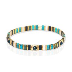 This handmade gold Tila bead bracelet features scattered glass stone embellishments for a shimmering, one-of-a-kind style. The scattered glass stone adds an eye-catching sparkle, making it an ideal accessory for special occasions. Gold-Plated Brass, glass Style No. EAB-14 Tila Bead Bracelet, Bracelet Miyuki, Turquoise And Black, Handmade Gold, Bijoux Diy, Beaded Stretch Bracelet, Jewelry Handmade, Bead Bracelet, Green Glass