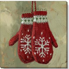 two red mittens hanging from a string with snowflakes on them