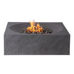 an outdoor fire pit with rocks on the bottom and flames coming out from it's sides