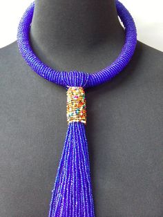 African beaded necklace made with the royal blue beads. Its a perfect accessory that will match most of your outfits. Suitable for any season. A good gift to your friends and loved ones. Blue Tassel Necklace For Gift, Elegant Blue Beaded Necklaces With Large Beads, Elegant Blue Beaded Necklace With Large Beads, Elegant Large Blue Beads, Elegant Blue Large Beads, Blue Bohemian Necklaces For Party, Blue Tassel Necklace, Elegant Blue Tassel Necklace As Gift, Elegant Blue Beads For Party