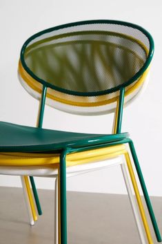 two green and yellow chairs sitting next to each other