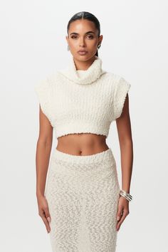 Our soft and luxurious cropped sweater in a creamy off-white is crafted with a turtleneck design and slouchy-dropped arm holes. Completed with a relaxed fit, a plush bouclé feel, and a champagne-taste-look. Style with our matching skirt, denim, and more. Knits Collection Import 54% Polyester, 28% Nylon, 11% Acrylic, 7% Wool Model wears size XS True to size Champagne Taste, Skirt Denim, Naked Wardrobe, Denim Sweater, Women's Shapewear, Turtle Neck Top, Cropped Sweater, Grey Sweater, Knit Jersey