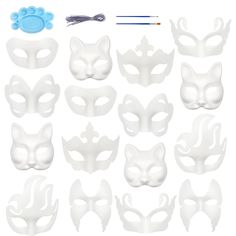 a set of white masks with different shapes and sizes, including one cat's paw