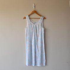 This Vintage Vanity Fair Pastel Floral Sleep Dress Night Gown in Size Small is a charming addition to your sleepwear collection. The delicate pastel floral print adds a touch of femininity, while the soft fabric ensures a comfortable night's sleep. Perfect for lounging or sleeping in style, this night gown radiates vintage elegance. ○ No material label, probably nylon and spandex ○ Size Small ○ Measurements (taken flat) pit to pit: 18.5" total length (from the front): 32" ○ Excellent pre-loved c Multicolor Spring Nightgown For Loungewear, Multicolor Spring Nightgown For Pajama Party, Spring Multicolor Nightgown For Pajama Party, Multicolor Nightgown For Spring Pajama Party, Multicolor Spring Nightgown For Sleep, Spring Multicolor Nightgown For Sleep, Multicolor Nightgown For Pajama Party In Spring, Spring Floral Print Nightgown For Home, Spring Floral Print Nightgown For Pajama Party