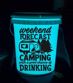 a blue bucket with the words weekend forecast camping and a camper on it at night