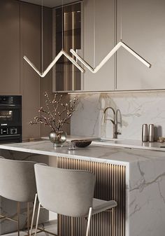 a modern kitchen with marble counter tops and bar stools