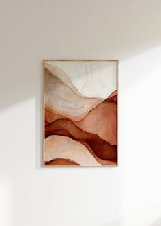 an abstract painting hangs on the wall above a bed in a room with white walls