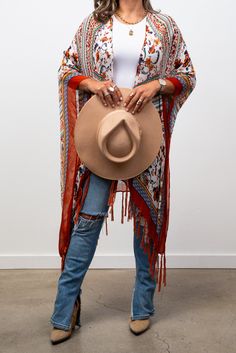 The Bohemian Tassel kimono boasts a striking diamond floral pattern and delicate tassels, creating an elegant and distinctive style. This is a OSFM item (One Size Fits Most) fits comfortably sizes 0-12 Western Kimono Outfit, Bohemian Brown Kimono For Fall, Bohemian Beige Kimono For Festival, Brown Bohemian Open Front Kimono, Bohemian Brown Open Front Kimono, Bohemian Fringe Kimono For Festival, Bohemian Tassel Kimono For Fall, Bohemian Fall Kimono With Tassels, Fringe Kimono For Beach In Fall