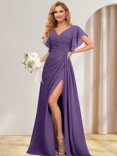 a woman in a long purple dress posing for the camera with her legs slited