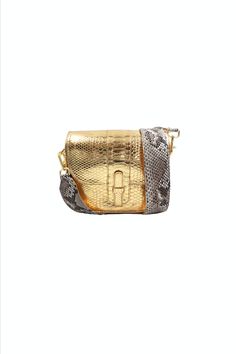 This one-of-a-kind bag fits everything comes with hooks to attach an optional strap. Detailed with a concealed magnetic closure, interior slip pocket, and fully lined. Made in Italy from responsibly sourced Python. Color: Metallic Gold Composition: Python Width: 8.8"Height: 7.7"Depth: 3" *A portion of the proceeds of the sale of this bag will benefit the Fish & Wildlife Foundation of Florida. "The Kara bag is one of my favorite everyday bags. With a modern twist on my traditional python strap, this unconventional style adds an edge to any casual outfit." XK Luxury Square Travel Bag, Luxury Square Shoulder Bag For On-the-go, Luxury Clutch Shoulder Bag For On-the-go, Luxury Square Satchel For On-the-go, Designer Square Wallets For Everyday, Designer Square Wallets, Luxury Flap Bag With Gold-tone Hardware, Designer Rectangular Wallets With Mobile Phone Bag, High-end Travel Pouch Flap Bag