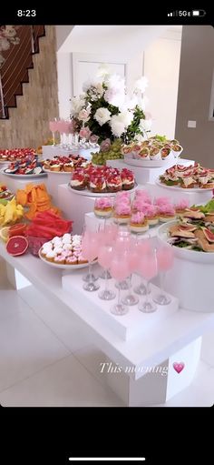 a table filled with lots of different types of food on it's sidelines