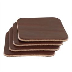 "Leather Coasters made from Wickett & Craig Traditional Harness Leather. Square shape. Medium Brown (4 pc set)  Color: Medium Brown  Size: 3.75 inch  Weight: 8-12 oz (Thickness: 3.2-4.8mm --- 1/8\"-3/16\")  Grade: #1 and #2 (Standard & Utility) - Best quality at the Tannery, meaning the least amount of imperfections on the leather! Back Side: Refinished in medium brown, with gum paste! Edge: Unfinished cut edge ------------------------------------------------------  The Tannery: Wickett & Craig English Bridle, Leather Coasters, Leather Apron, Chewing Gum, Original Bags, Gum Paste, Medium Brown, Smooth Texture, Square Shape