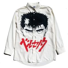 "Off-white Button down, hand-painted with the face of Guts inspired by the manga/anime Berserk. One-of-a-kind hand-painted anime-inspired designs! \"You're right, we are mortal and fragile. But even if we are tortured or wounded, we'll fight to survive. You should feel the pain we feel and understand. I am the messenger that will deliver you to that pain and understanding\" - Guts" Long Sleeve Shirt With Character Print For Streetwear, Pop Culture Anime Print Shirt For Cosplay, Harajuku Style Shirt With Character Print For Cosplay, Harajuku Style Screen Print Shirt For Cosplay, Casual Cosplay Shirt With Screen Print, Casual White Shirt For Cosplay, Anime Style White Shirt With Graphic Print, Anime Style Graphic Print White Shirt, Anime Style White Graphic Print Shirt