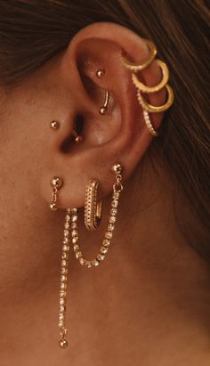 Classic Gold Piercings With Matching Earrings, Party Huggie Single Earring, Party Single Huggie Earring, Elegant Gold Hoop Piercings, Gold Diamond Piercing, Dainty Gold Piercings With Diamond Accents, Gold Diamond Huggie Ear Cuff, Elegant Gold Hoop Earrings With Bling, Gold Dangle Diamond Earrings For Pierced Ears