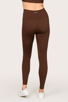 Soft like butter. Our Barre Seamless Tight features a luxurious feel paired with subtle rib details that elongate the legs. Effortlessly easy and comfortable, this tight is one for both lounging and living.This style of seamless leggings run small. Please consider sizing up. Ribbed seamless tight Inseam 25" Knit-in logo Ideal for low impact workouts such as yoga Fitted Full Length Ribbed Activewear, Tight Seamless Solid Bottoms, Tight Solid Seamless Bottoms, Tight Solid Bottoms With Seamless Construction, Compressive Solid Ribbed Leggings, Compressive Ribbed Leggings, Compressive Ribbed Solid Color Leggings, Compressive Solid Color Ribbed Leggings, Fitted Solid Ribbed Leggings