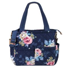 a blue purse with flowers on the front and shoulder strap, it has a zippered closure