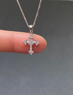 "Tiny Sterling Silver Cross CZ Necklace Minimalist and Dainty Metal: All components are made from solid .925 Sterling Silver Stone: Cubic Zirconia Measurement: pendant height is 21mm (0.83\") and 12mm (0.47\") wide Choose Chain Length At Checkout You can find other cross jewelry in my shop here https://www.etsy.com/shop/LinksAndStones?ref=seller-platform-mcnav&section_id=24376960 Please feel free to Convo me with any questions before purchasing. Please view policy before purchasing Thank You Silver Sterling Silver Cross Necklace With Diamond Cut, Sterling Silver Diamond Cut Silver Cross Necklace, Sterling Silver Diamond Cut Pendant Cross Necklace, Silver Cross Necklace Gift, Silver Cross Necklace For Gift, Silver Cubic Zirconia Cross Necklace Gift, Diamond White Sterling Silver Cross Necklace For Gift, Gift Diamond White Sterling Silver Cross Necklace, Diamond White Sterling Silver Cross Necklace As Gift