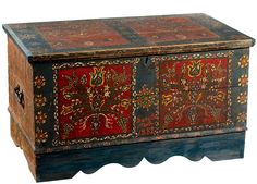 an old wooden box with painted designs on it