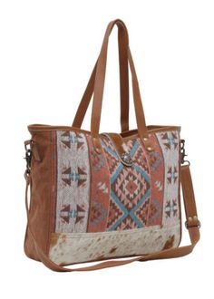 Crafted for the modern adventurer, this exquisite tote bag combines the timeless appeal of a beautiful Southwest printed canvas with the durability and sophistication of leather and hide accents. Featuring double shoulder straps for easy carrying and an adjustable crossbody strap for hands-free convenience, this tote offers versatility and comfort in any situation. The full zip and magnetic flap closure ensure your belongings are secure yet easily accessible, providing peace of mind whether you' Canvas Tote Bag With Adjustable Straps, Travel Canvas Tote Bag With Adjustable Straps, Canvas Tote Shoulder Bag With Adjustable Straps, Chic Canvas Shoulder Bag With Adjustable Handle, Daily Use Canvas Bags With Adjustable Straps, Canvas Hobo Bag With Adjustable Strap, Beige Canvas Bags With Adjustable Straps, Rectangular Canvas Bag With Adjustable Straps For Travel, Brown Canvas Hobo Bag With Adjustable Strap