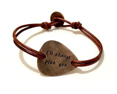 "Make the perfect personalized gift for the musician or music lover in your life. Hand stamped inspirational bracelet that carries messages, words, symbols, quotes and sayings to inspire, motivate and encourage the wearer. Metal - Copper Guitar Pick - The size and shape is of a standard guitar pick hand cut with my saw from 18ga metal sheet. Engraving - Hand stamped with up to 30 characters on each side. Leather - Double 2.2mm genuine leather with button clasp. Finish - Oxidized. Size - To find Bracelet En Cuir Diy, Guitar Pick Jewelry, Custom Guitar Picks, Diy Leather Bracelet, Diy Leather Projects, Inspirational Bracelets, Beads Bracelet Design, Personalized Bracelet, Bracelet Leather