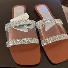 Slide Sandals In Silver. Vinyl Upper With Rhinestone Details. Squared Toe. Sole Height: 0.5 Inches (1.2 Cm) Silver | 3651/810 Glamorous Clear Sandals With Rhinestones, Sparkling Flat Sandals For The Beach, Elegant Sparkling Beach Sandals, Zara Embellished Open Toe Sandals, Zara Embellished Glamorous Sandals, Zara Sandals With Rhinestones For Parties, Zara Sandals With Rhinestones For Evening, Zara Rhinestone Sandals For Party, Zara Flat Sandals For Party