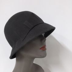 "Vintage hat with a side bow. Absolutely beautiful! Good vintage condition, please look at all pictures closely. It looks to be from the 1940s or 1950s. Made of wool. It comes with a picture of the style. Size 21\" circumference 2\" brim, 4\" tall" Classic Cloche Felt Hat For Evening, Classic Evening Cloche Felt Hat, Wool Cloche Hat For Evening, Classic Cloche Hat For Vintage Events, Retro Cloche Hat For Vintage Events, Vintage Wool Cloche Hat With Curved Brim, Classic Cloche Evening Hat, Classic Evening Cloche Hat, Vintage Wool Cloche Hat With Short Brim