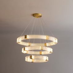 a modern chandelier hanging from the ceiling