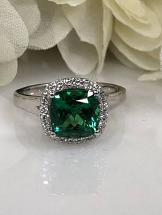 Cushion Cut Emerald And Genuine Diamond Halo Style Ring  Set In 14K White Gold #5459 Emerald Halo Ring For Formal Occasions, Classic Green Cubic Zirconia Halo Ring, Halo Promise Ring With May Birthstone, May Birthstone Halo Ring For Promise, Formal Diamond Ring With Halo For May Birthstone, Green Halo Diamond Ring For Anniversary, Formal Green Cubic Zirconia Halo Ring, Formal May Birthstone Emerald Ring With Halo Setting, Emerald Halo Ring For Promise