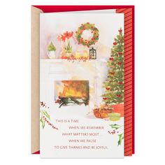 a christmas card with a fireplace and wreath