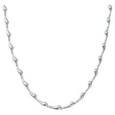 Reminiscent of raindrops. Necklace is 16" chain in sterling silver. No longer manufactured by Tiffany's. Lobster clasp. Used, but in good condition. Original designs copyrighted by the Nando and Elsa Peretti Foundation. Elsa Peretti, Tiffany And Co, Rain Drops, Chain Link Necklace, Link Necklace, Tiffany & Co., Sterling Silber, Chain Link, Chains Necklace