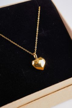 Add some love to your look with our Cherished Heart Necklace. Featuring an 18K gold plated chain and a unique geometric heart pendant. It is 18" long and has a 2" chain extender so you can adjust the length to your liking. This necklace is perfect for adding a touch of elegance to any outfit or could be the perfect gift for a special loved one. Pair with our cherished heart earrings! Gold Heart Pendant Necklace With Box Chain, Gold Heart Necklace With Box Chain, Heart Pendant Necklace With Box Chain As Gift, Heart Pendant Necklace With Box Chain For Gift, Gold Teardrop Pendant Necklace For Valentine's Day, Geometric Heart, Perfect Gif, Chain Extenders, Gold Plated Chains