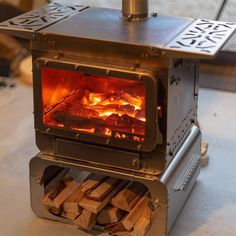 a stove that has some wood in it