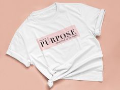 "There is a PURPOSE attached to her name" Premium Fitted T-shirt. This is as perfect as perfect gets: it's soft yet stretchy, a little longer than a standard tee and figure-flattering. ITEM RUNS SMALL.  - 100% cotton | Fabric weight: 4.42 oz (lightweight)  - Fairly produced, certified and triple audited  - Optimized for vibrant print results  - Double-stitched ribbed collar and hems  - Imported; processed and printed in the U.S.A.Kindly refer to our size guide below for best fit.Women’s Premium Neoprene Face Mask, Women Feminist, Feminist Tshirt, Pride Tees, Baby T Shirts, Baby T Shirt, Baby Tshirts, Women Empowerment, Womens Clothing Tops