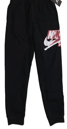 Elevate your little Jordan fan's activewear game with these NWT Nike Air Jordan Jumpman Logo black fleece joggers. The pants feature an elastic waist and tapered leg style for a comfortable and secure fit. With pockets for storage, these joggers are perfect for school, basketball, or running and jogging during fall, winter, and spring. Made from a cotton blend, these joggers are machine washable for easy care. The classic Jordan character and theme make these pants a must-have for any young athl Jordan Character, Stylish Mens Suits, School Basketball, Jumpman Logo, Young Athletes, Logo Black, Black Fleece, Fleece Joggers, Nike Air Jordan