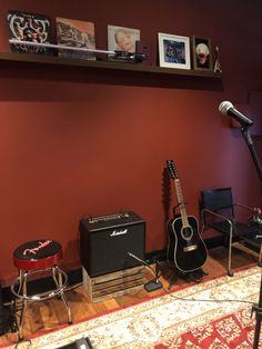 a room with guitars and other musical equipment