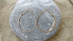 "These large teardrop hoop earrings are an interesting twist in the standard hoops. They are made from a high quality sterling silver or gold filled wire and hammered to hold their shape and give them shine. They slide easily onto your ear and lock in place with a hook and eye closure. So lightweight you can hardly feel them! They won't weigh on your earlobe. Perfect for everyday! These are our large hoops, measuring 2.5\" long. Also available in Medium (2\") and small (1.5\") sizes. All items a Handmade Teardrop Earrings, Teardrop Hoop Earrings, Earrings Teardrop, Hammered Earrings, Sterling Silver Hoop Earrings, Sterling Silver Hoops, Silver Hoops, Silver Hoop Earrings, Earrings Silver