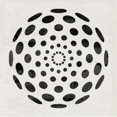 a black and white photo with dots in the center on a sheet of paper that has been cut into smaller circles