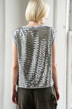 A sequin top with round necklineDetails:Self : 100% PolyesterSize & Fit- Model is 5`9" And Wearing Size Small- Measurements Taken From Size Small- Approx. Length: 23" Fall Party T-shirt With Sequins, Party Season Sequined Crew Neck T-shirt, Sequin T-shirt For Night Out In Spring, Spring Sequins T-shirt For Night Out, Spring Sequin T-shirt For Night Out, Glamorous Crew Neck Party Tops, Spring Night Out Sequined T-shirt, Fall Contrast Sequin Crew Neck Top, Glamorous Metallic Sequin Tops